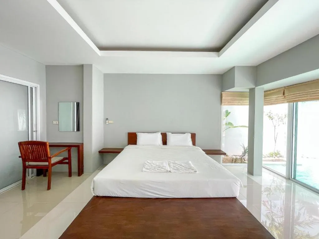 Bed in The Living Pool Villas
