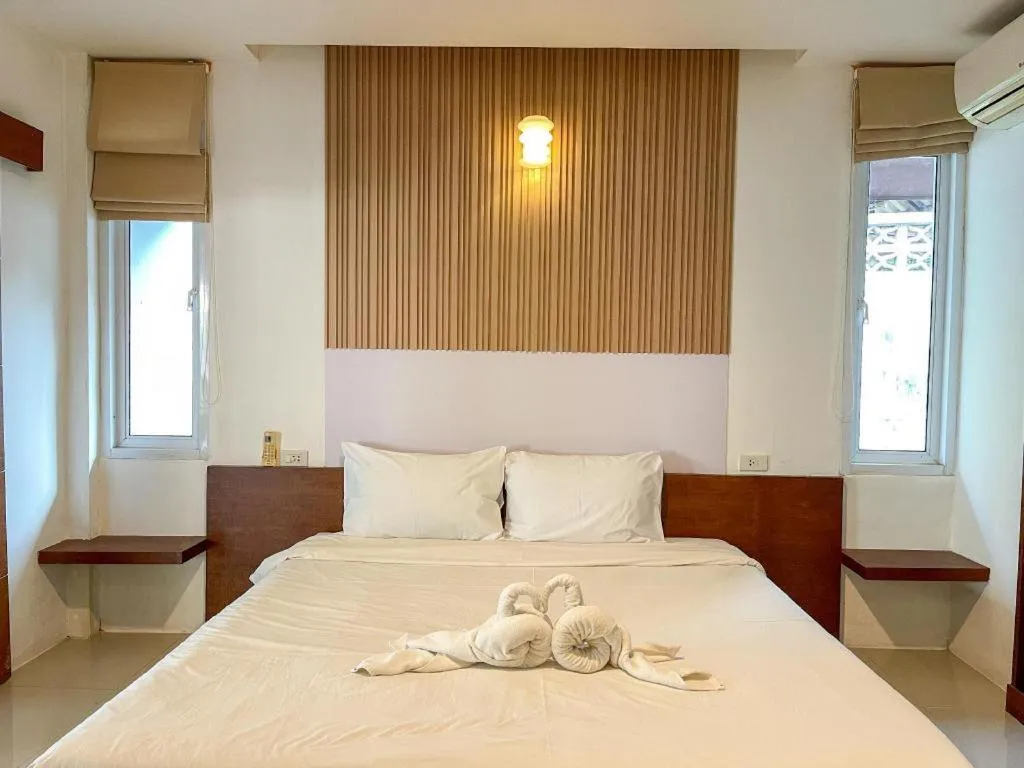 Bed in The Living Pool Villas