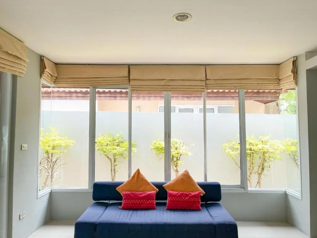 Bed in The Living Pool Villas