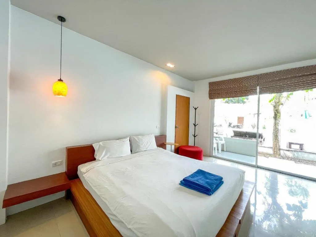 Bed in The Living Pool Villas