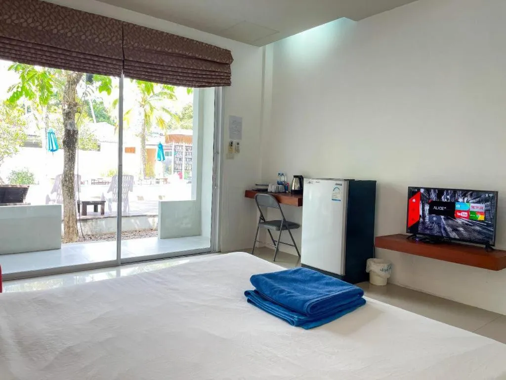 Bed in The Living Pool Villas