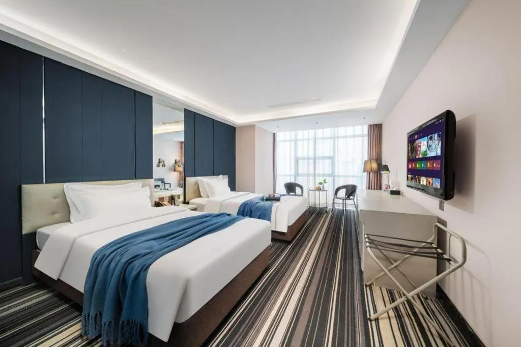 Bed in Urumqi Bayinhe Hotel