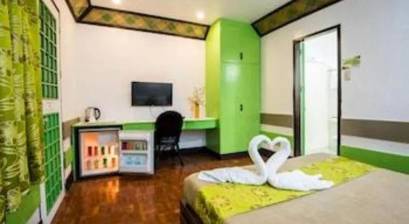 Bed in Family Country Hotel and Convention Centre