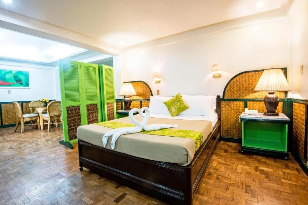 Bed in Family Country Hotel and Convention Centre