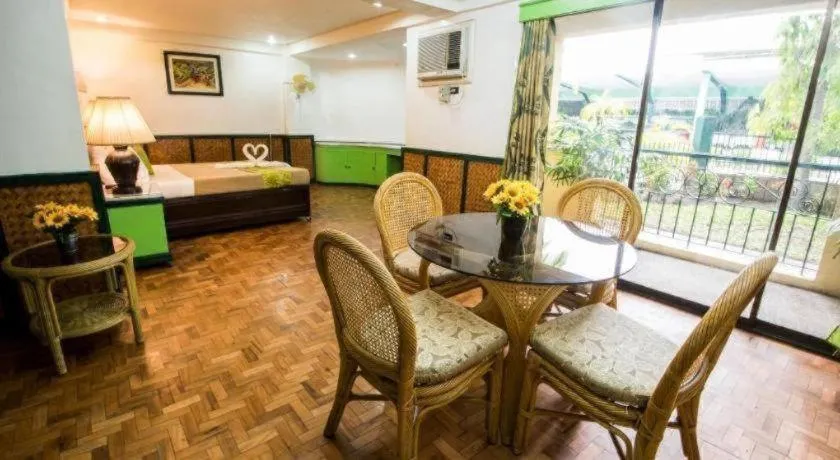 Bed in Family Country Hotel and Convention Centre