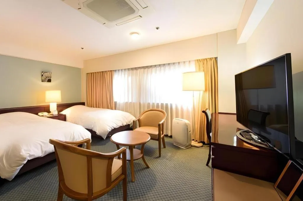 Bed in Oita Century Hotel