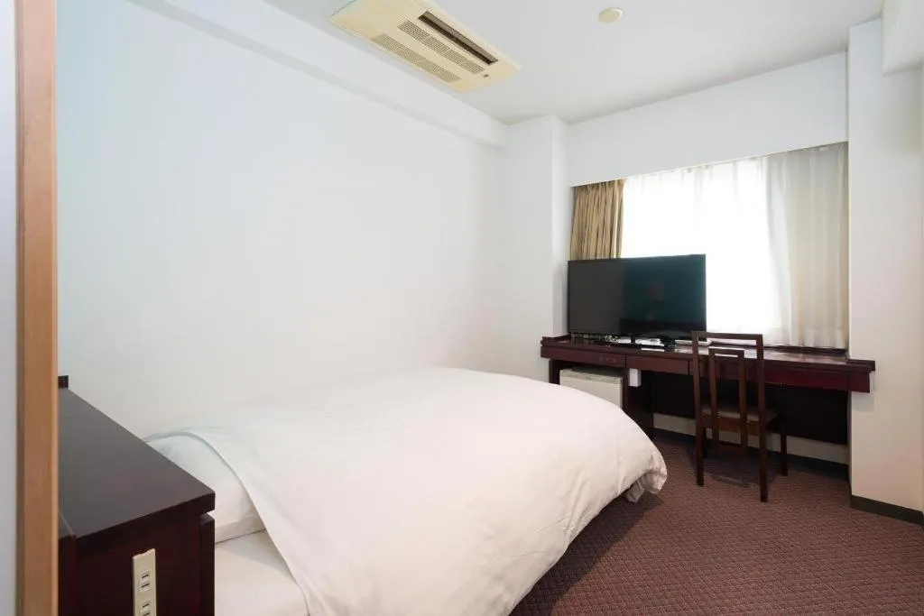 Bed in Oita Century Hotel