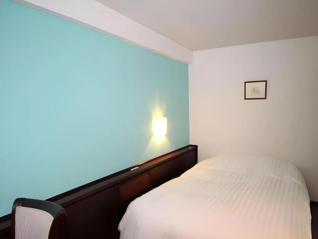 Bed in Oita Century Hotel