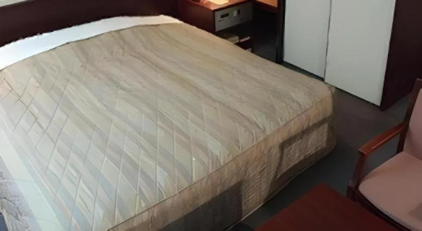 Bed in Oita Century Hotel