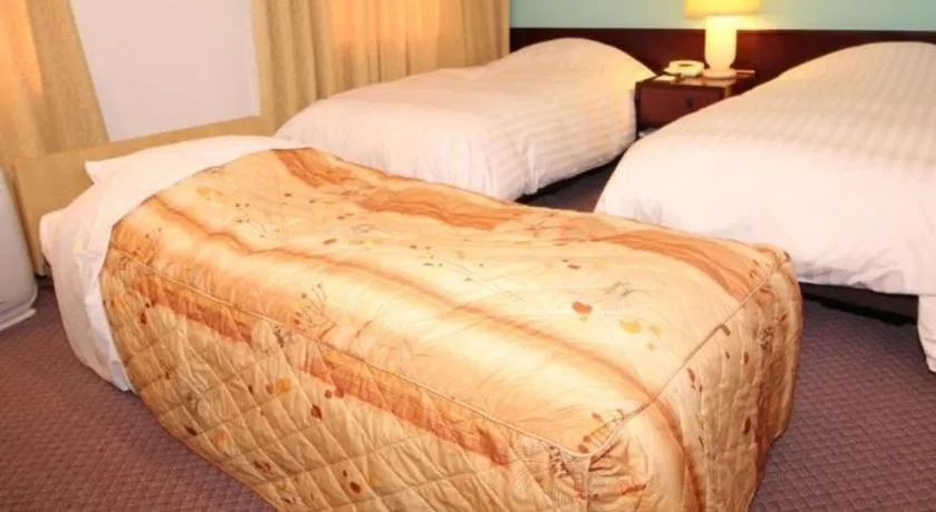 Bed in Oita Century Hotel