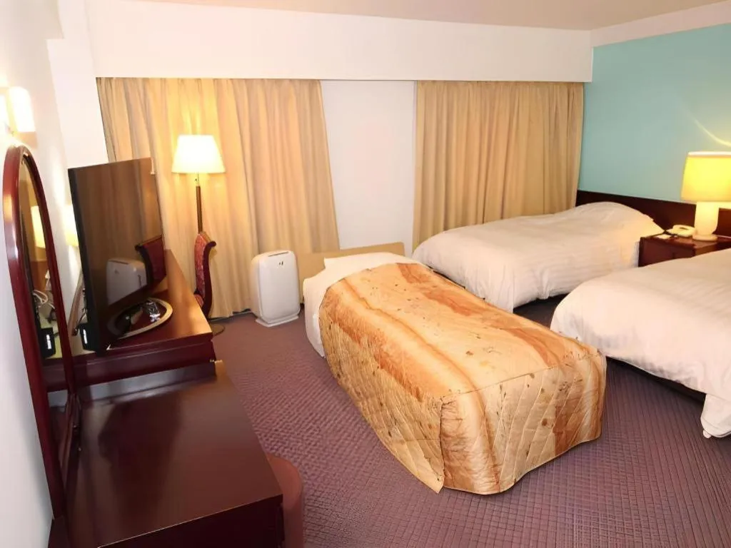 Bed in Oita Century Hotel