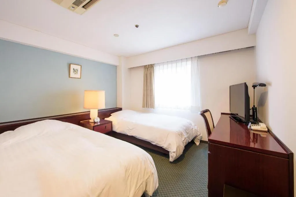 Bed in Oita Century Hotel