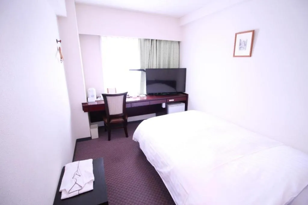 Bed in Oita Century Hotel