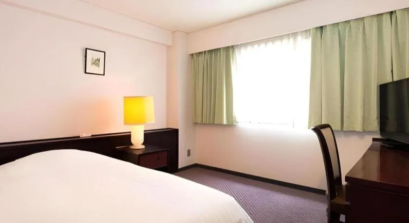 Bed in Oita Century Hotel