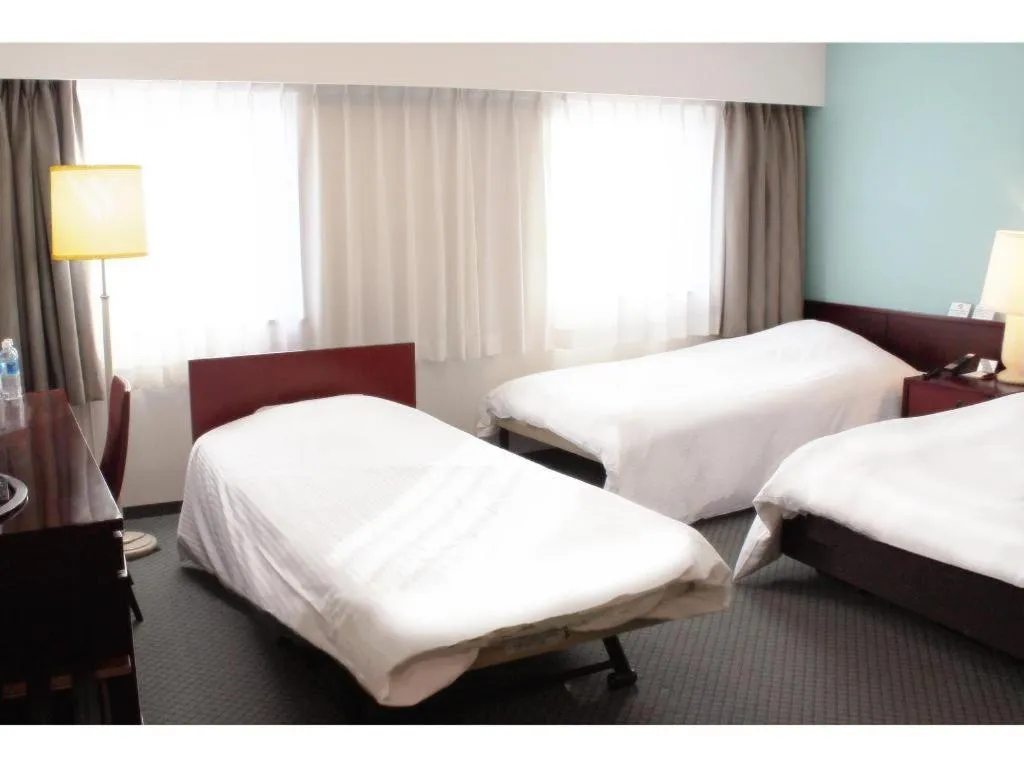 Bed in Oita Century Hotel