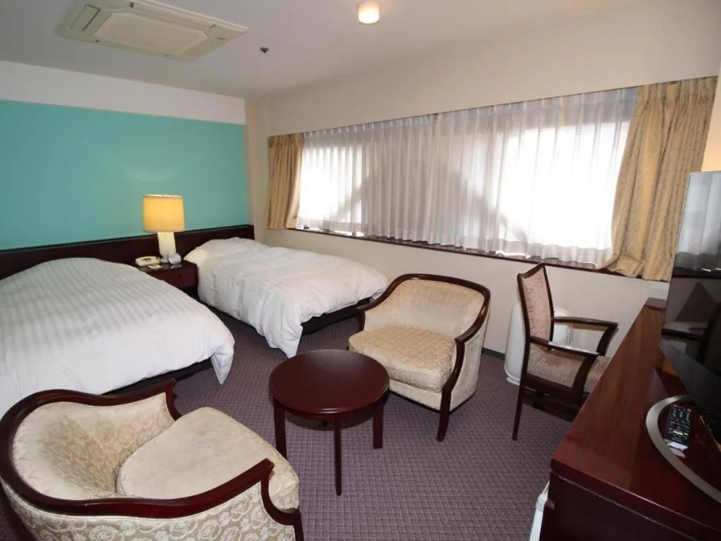 Bed in Oita Century Hotel