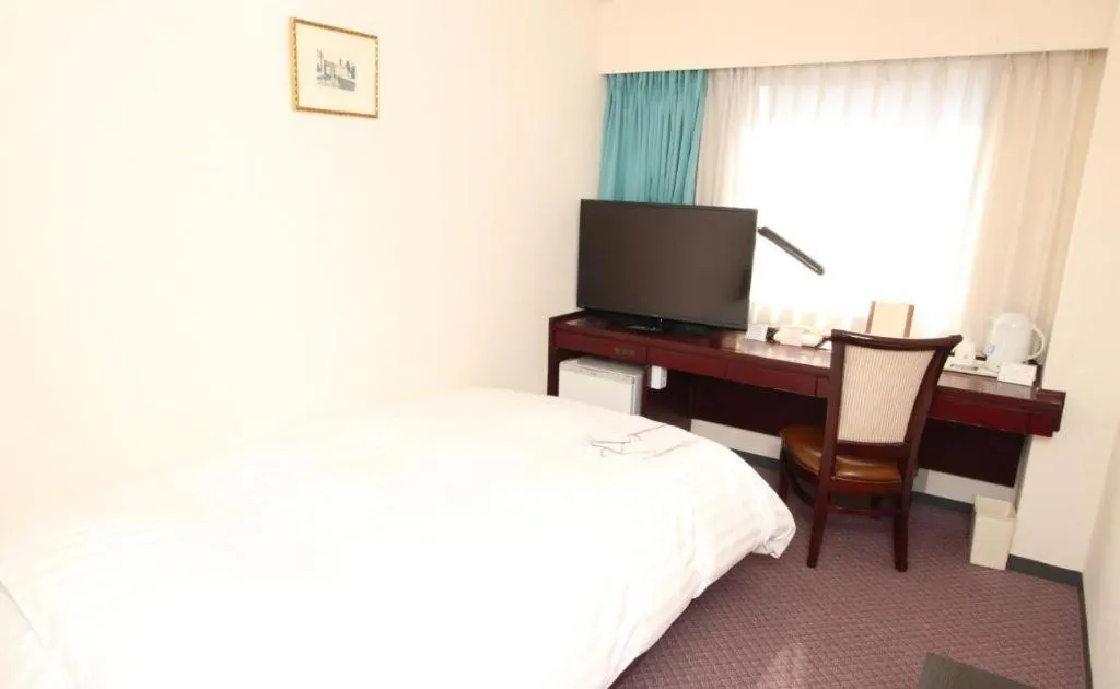 Bed in Oita Century Hotel