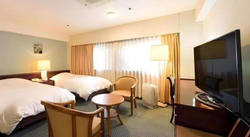 Bed in Oita Century Hotel