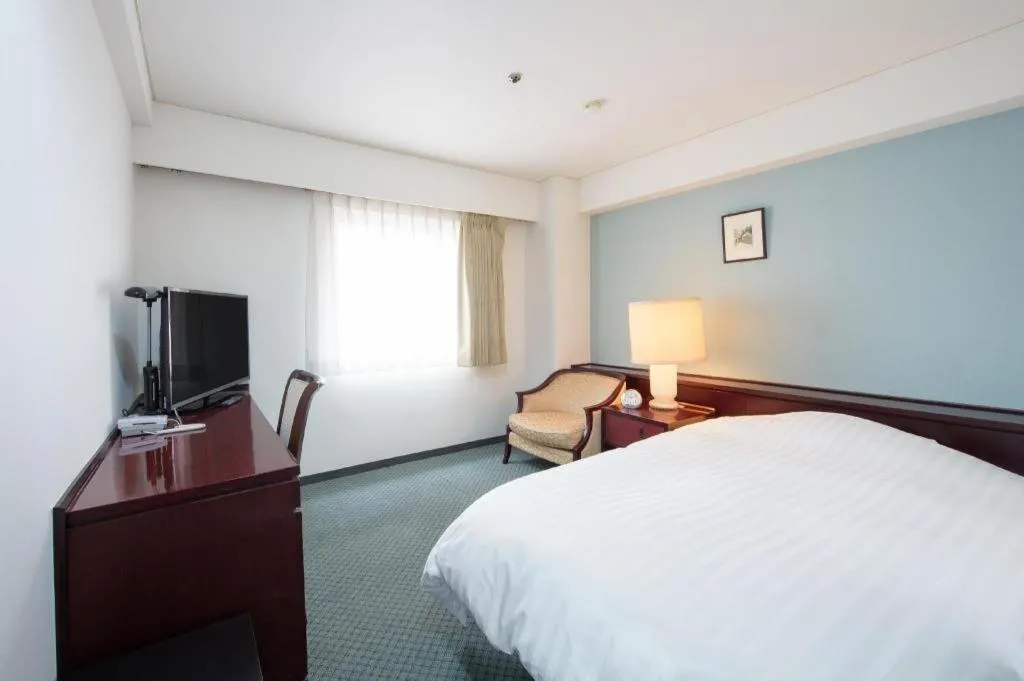 Bed in Oita Century Hotel