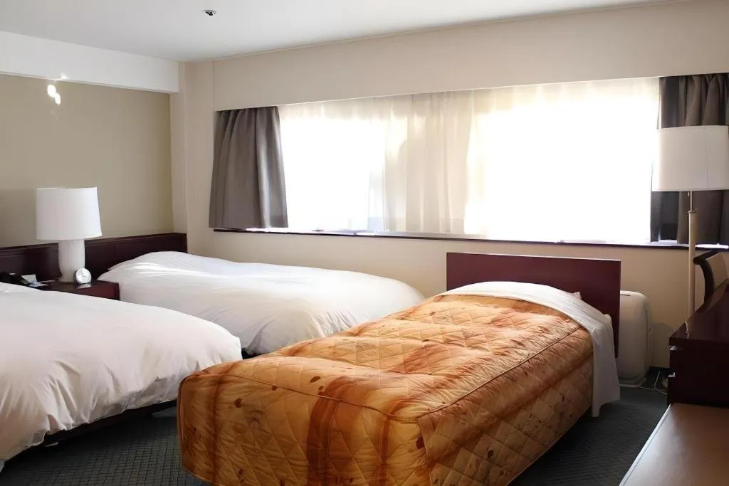Bed in Oita Century Hotel