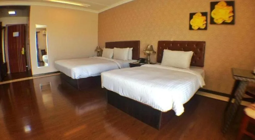 Bed in Grand Hoyah Hotel