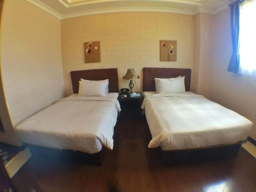 Bed in Grand Hoyah Hotel