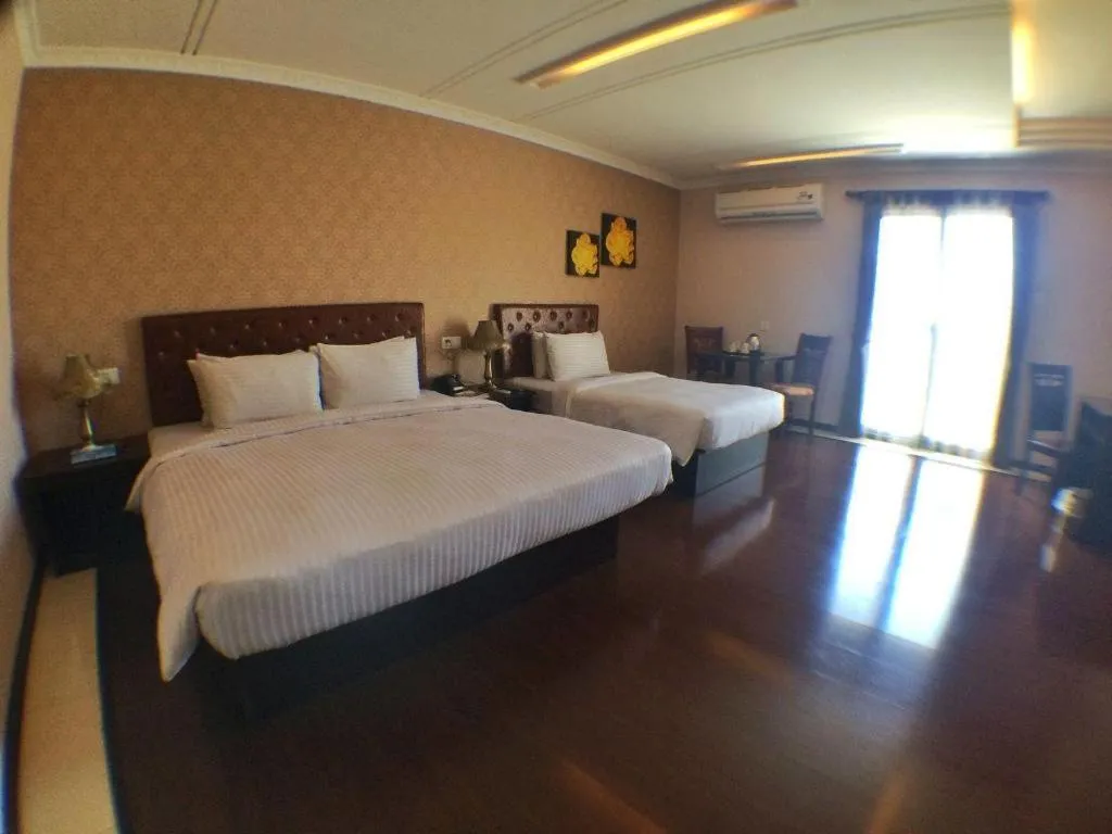 Bed in Grand Hoyah Hotel