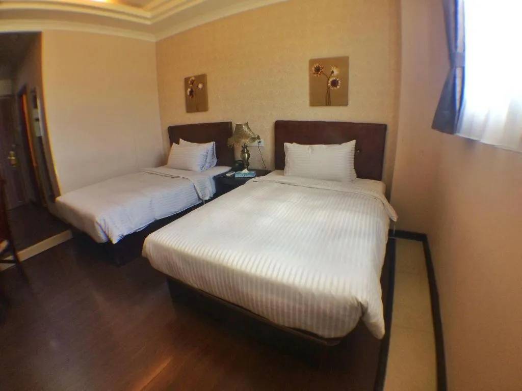 Bed in Grand Hoyah Hotel