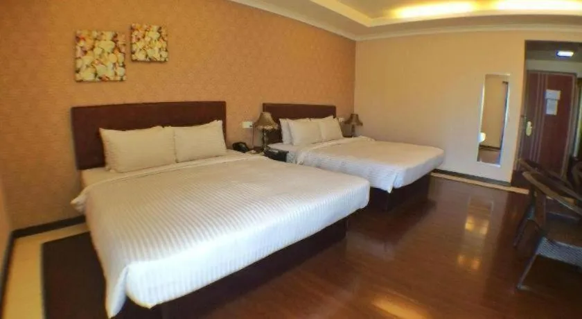 Bed in Grand Hoyah Hotel