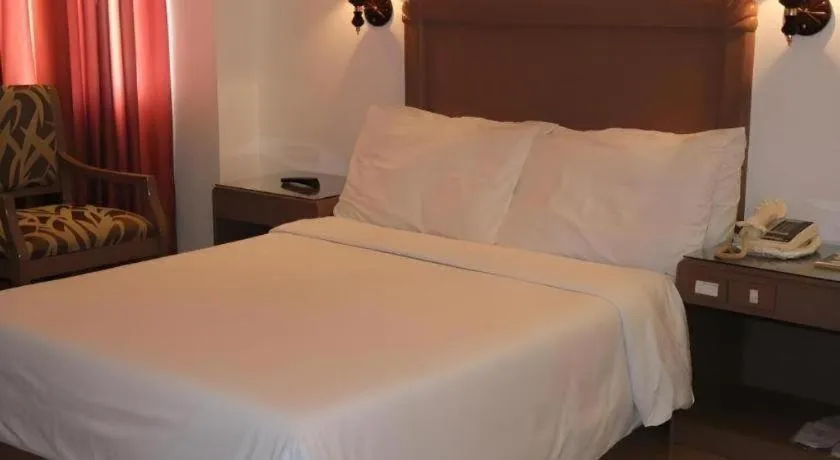 Bed in Alicia Hotel & Restaurant