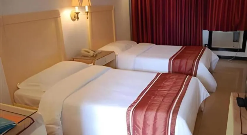 Bed in Alicia Hotel & Restaurant