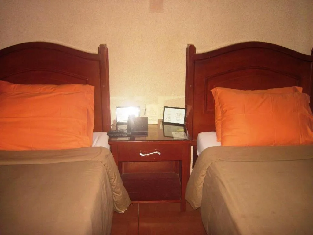 Bed in Alicia Hotel & Restaurant