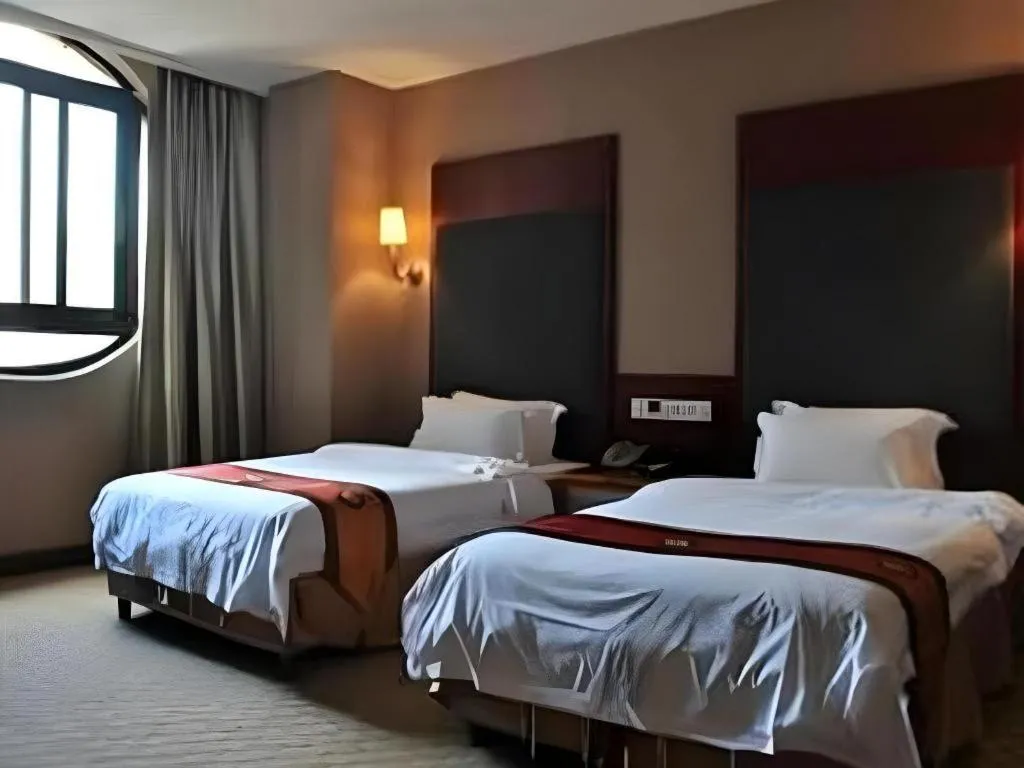 Bed in Guangna Hotel