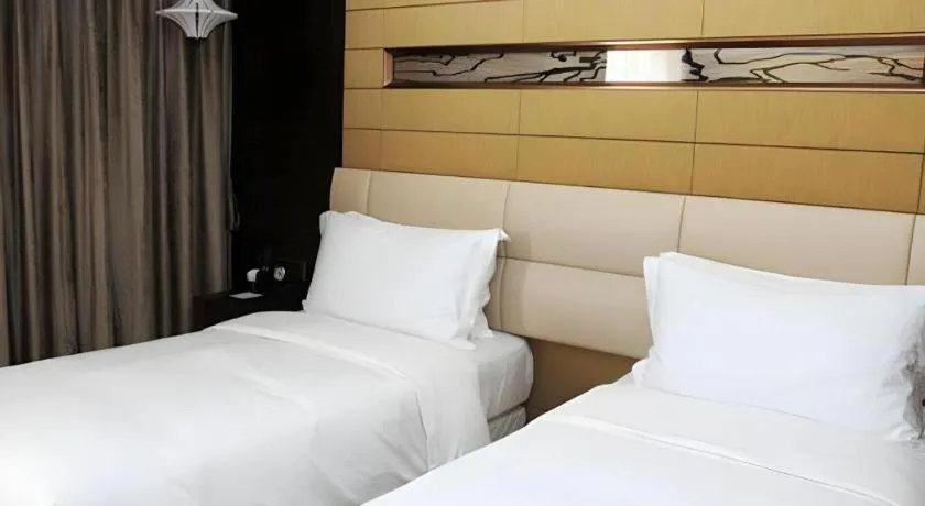 Bed in Grand Metropark Hotel Qingdao