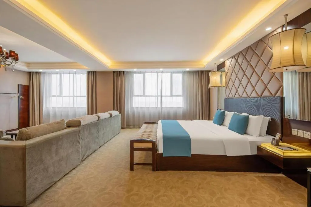 Bed in Aksu Pudong Holiday Hotel