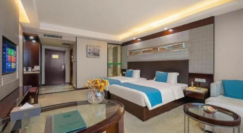 Bed in Aksu Pudong Holiday Hotel