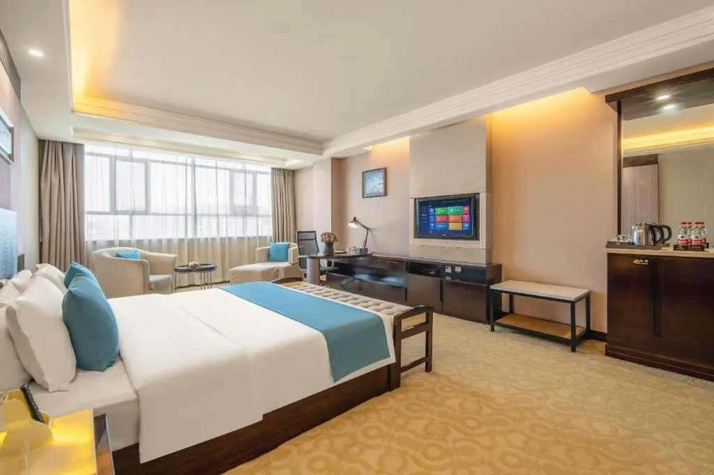 Bed in Aksu Pudong Holiday Hotel