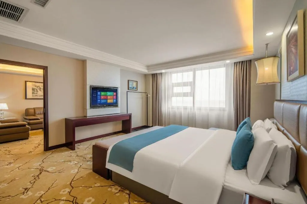 Bed in Aksu Pudong Holiday Hotel