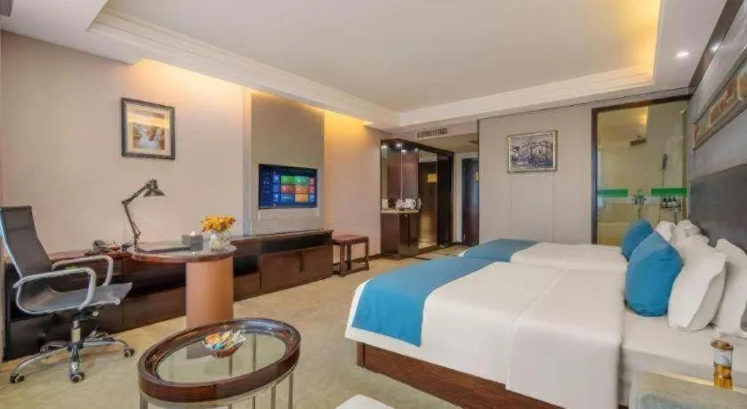 Bed in Aksu Pudong Holiday Hotel