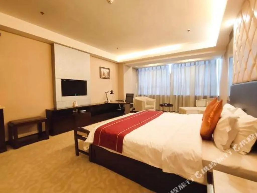 Bed in Aksu Pudong Holiday Hotel