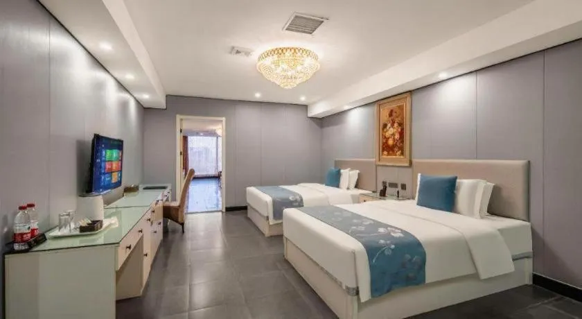 Bed in Aksu Pudong Holiday Hotel