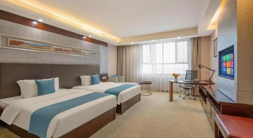 Bed in Aksu Pudong Holiday Hotel