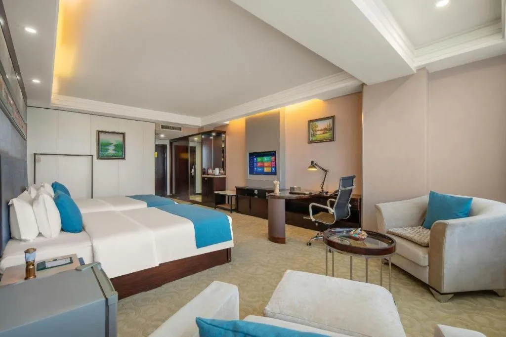 Bed in Aksu Pudong Holiday Hotel