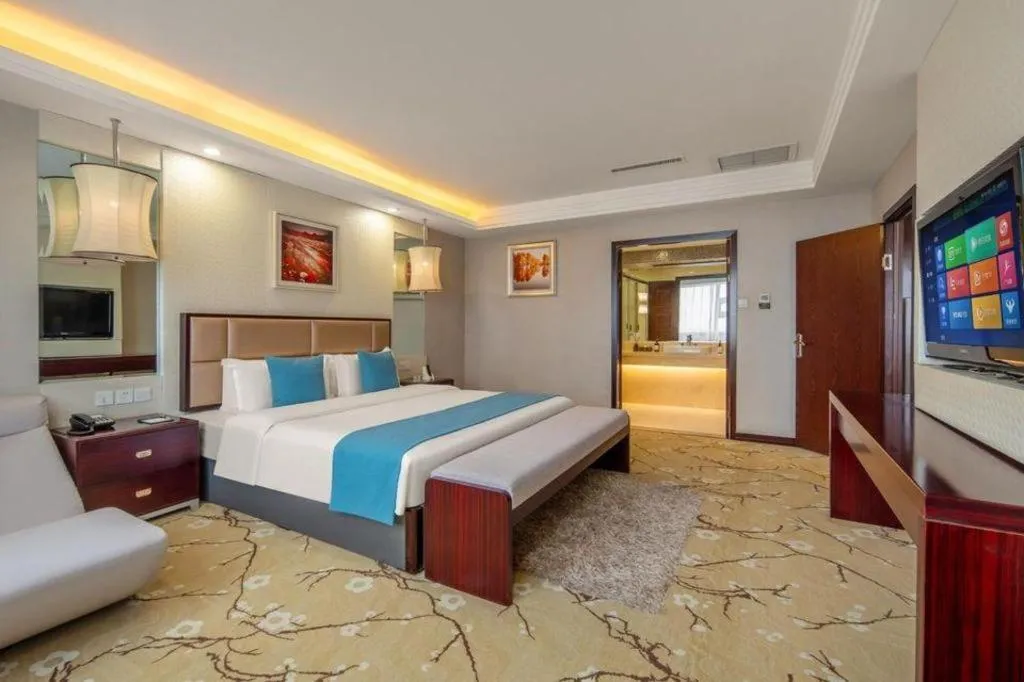 Bed in Aksu Pudong Holiday Hotel