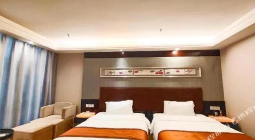 Bed in Aksu Pudong Holiday Hotel