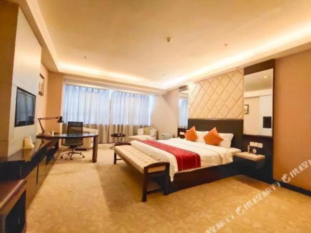 Bed in Aksu Pudong Holiday Hotel