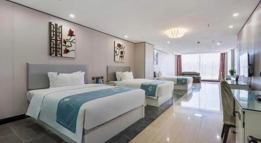 Bed in Aksu Pudong Holiday Hotel