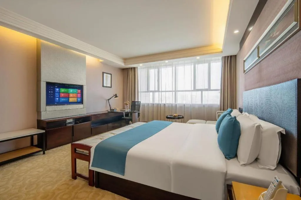 Bed in Aksu Pudong Holiday Hotel