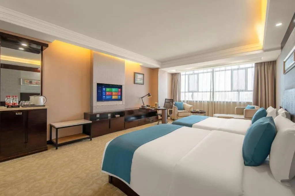 Bed in Aksu Pudong Holiday Hotel