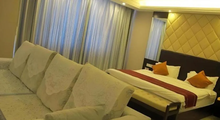 Bed in Aksu Pudong Holiday Hotel